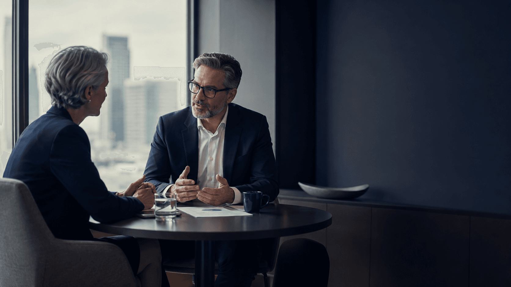 Manager and employee reviewing progress goals